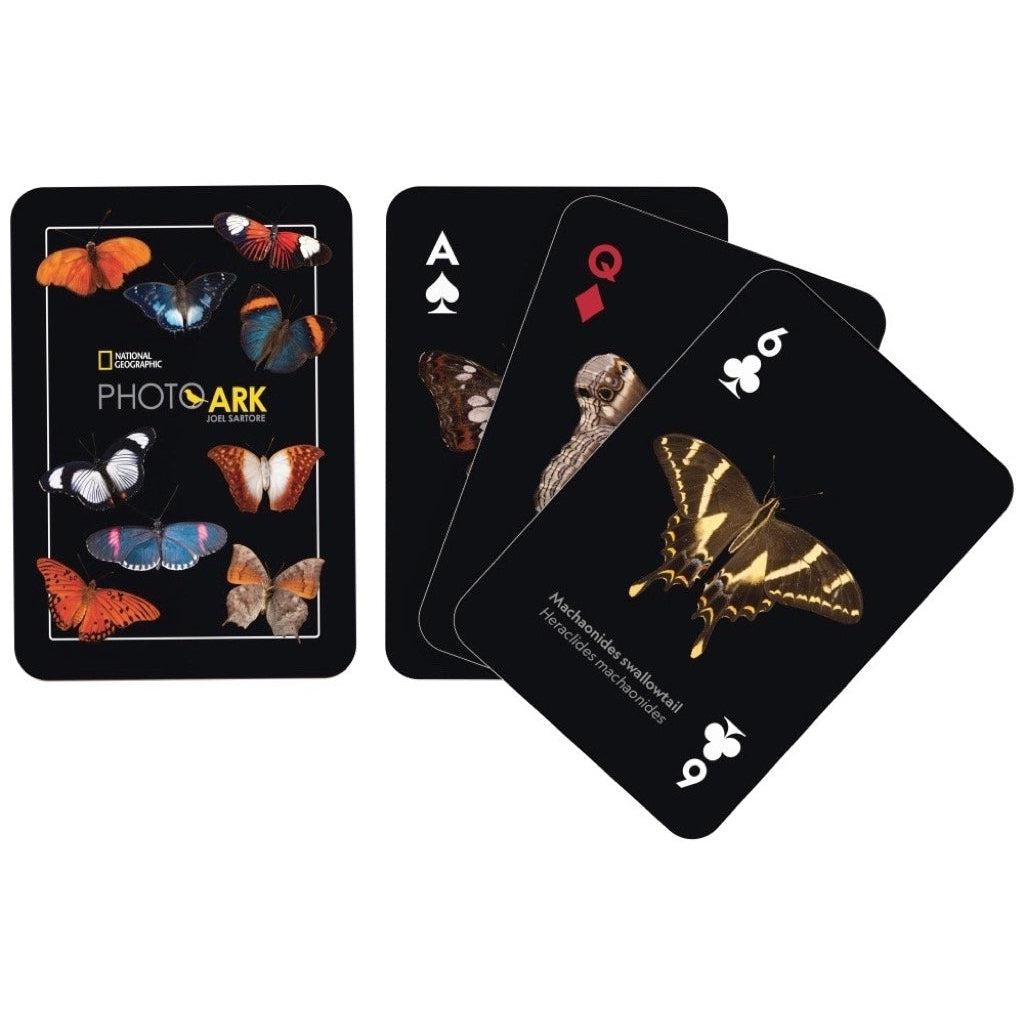 Image of the back of the deck of cards. On it are 9 pictures of different butterflies. Some examples include orange butterflies, blue butterflies, spotted butterflies, and brown butterflies.