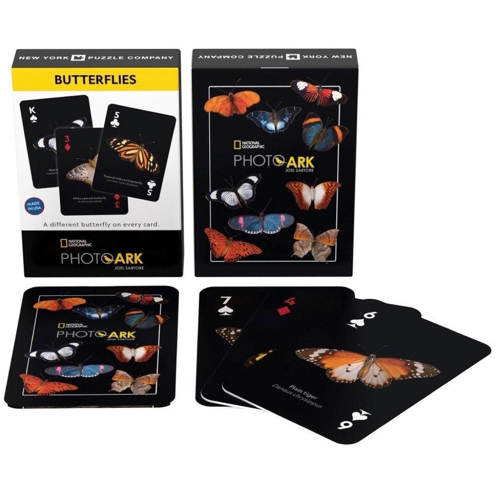 Image of the box, the back of the deck of cards, and the faces of three example cards. Each card has a black background to emphasize the pictures of the butterflies.