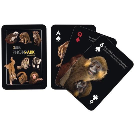 Image of the back of the deck of cards. On it are 9 pictures of different primates. Some examples include primates with masks, primates with long tails, and primates with small feet.