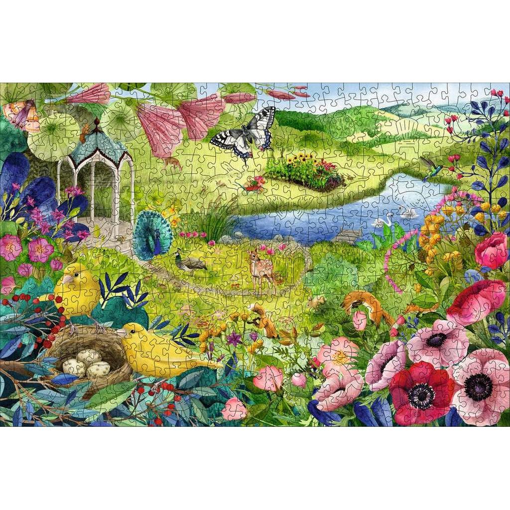 Image of the finished puzzle. It is a scene of a large green meadow with lots of flowers and birds framing the picture.