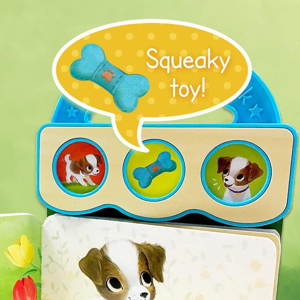 Shows that the yellow button with a picture of a blue dog toy makes a squeaky sound.