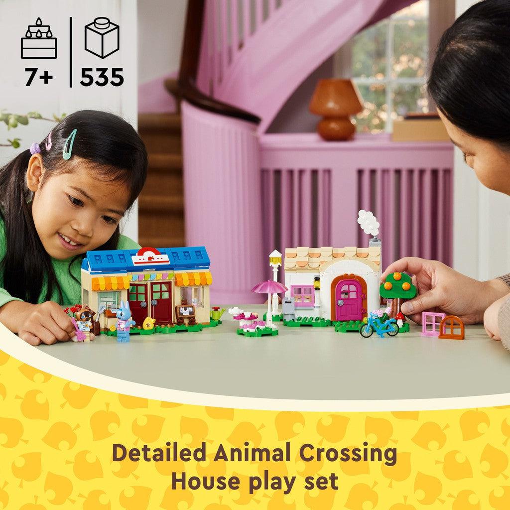 a child and parent shown playing with the finished lego set. Text reads: Detailed animal crossing house play set. Ages: 7+ and 535 pieces
