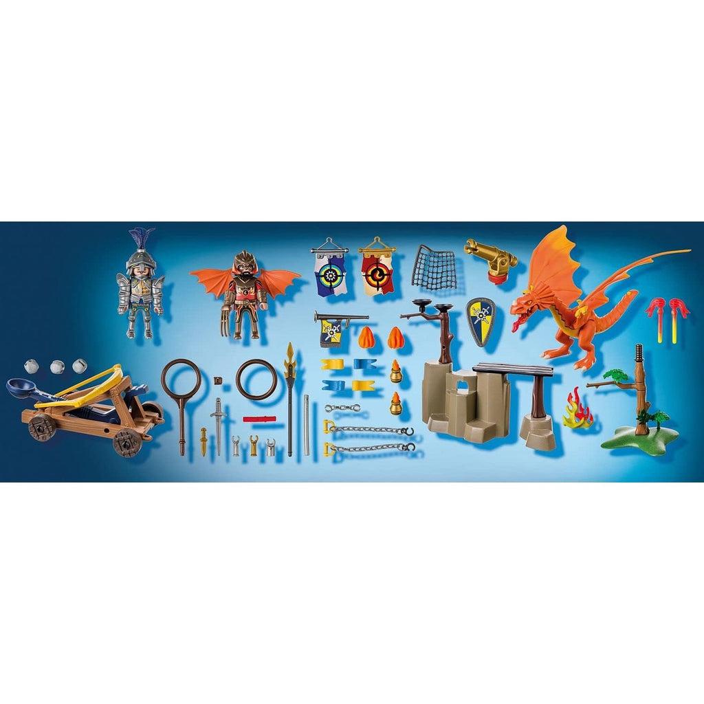 picture showing everything found in the box, a knight, a dragon tamer and his dragon, a carapult, and accessories for creating an arena for the fight to come. 