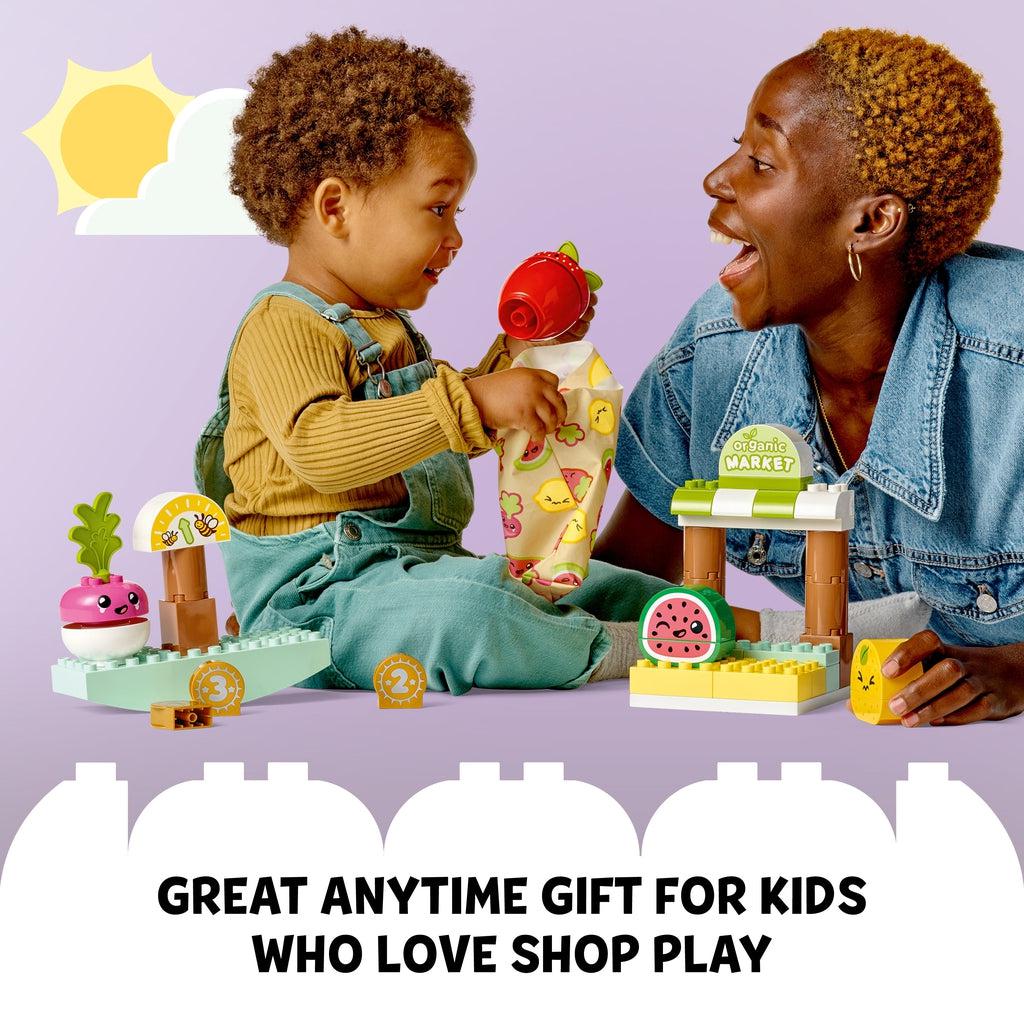 Scene of a mother playing with her son and the LEGO playset. Caption: Great anytime gift for kids who love shop play
