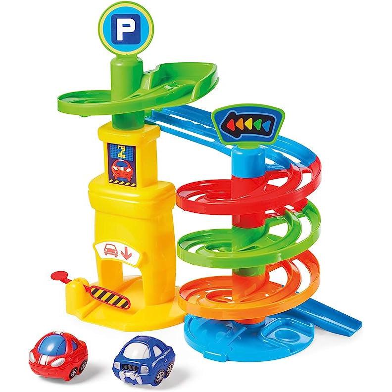 Image of the toy outside of the packaging. It is a spiraling downward ramp for cars to roll down to the bottom. The different sections of the toy are each a different bright color like red, yellow, or blue. One of the included cars is red and the other is blue.