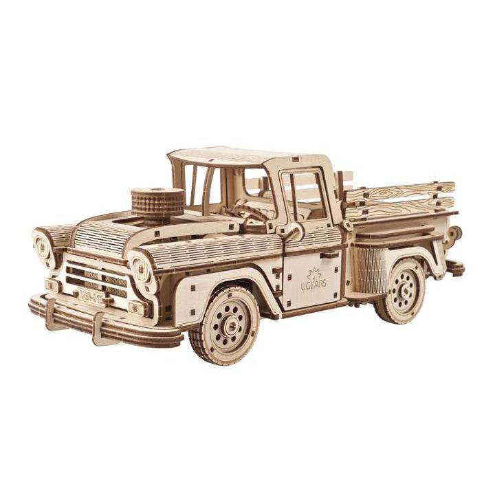Image of the Pickup Lumberjack model. It is made from unpainted wood truck with lots of detail and curved bits. It has the UGears logo on the side of the driver's door.