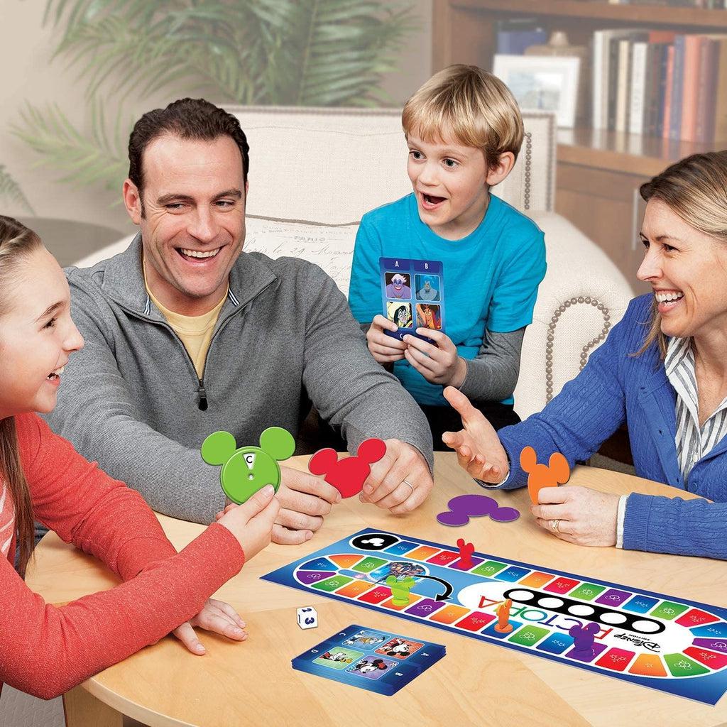 Scene of a family smiling while playing the board game.
