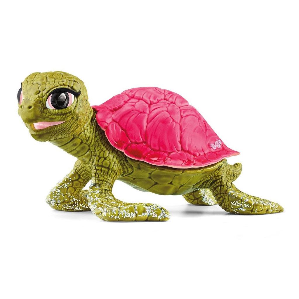 Image of the Pink Sapphire Turtle figurine. It has a pink shell and a seaweed green body.