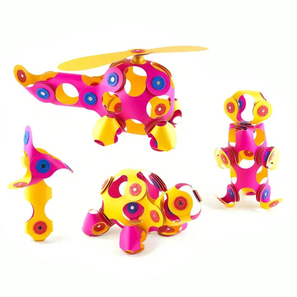 pink and yellow Clixo designs like a pinwheel, turtle, helicopter and more