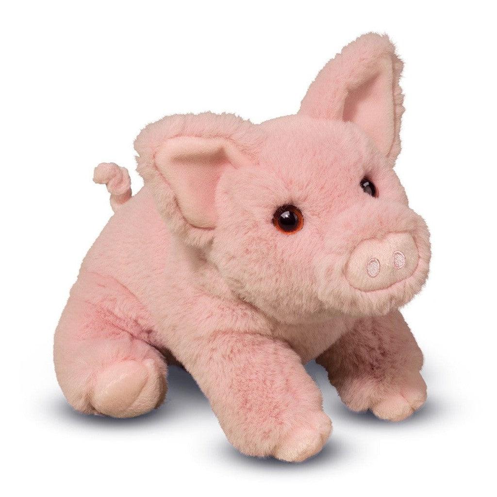 image shows a small stuffed pig animal. the fur is bright pink and it has a cute nose and tail