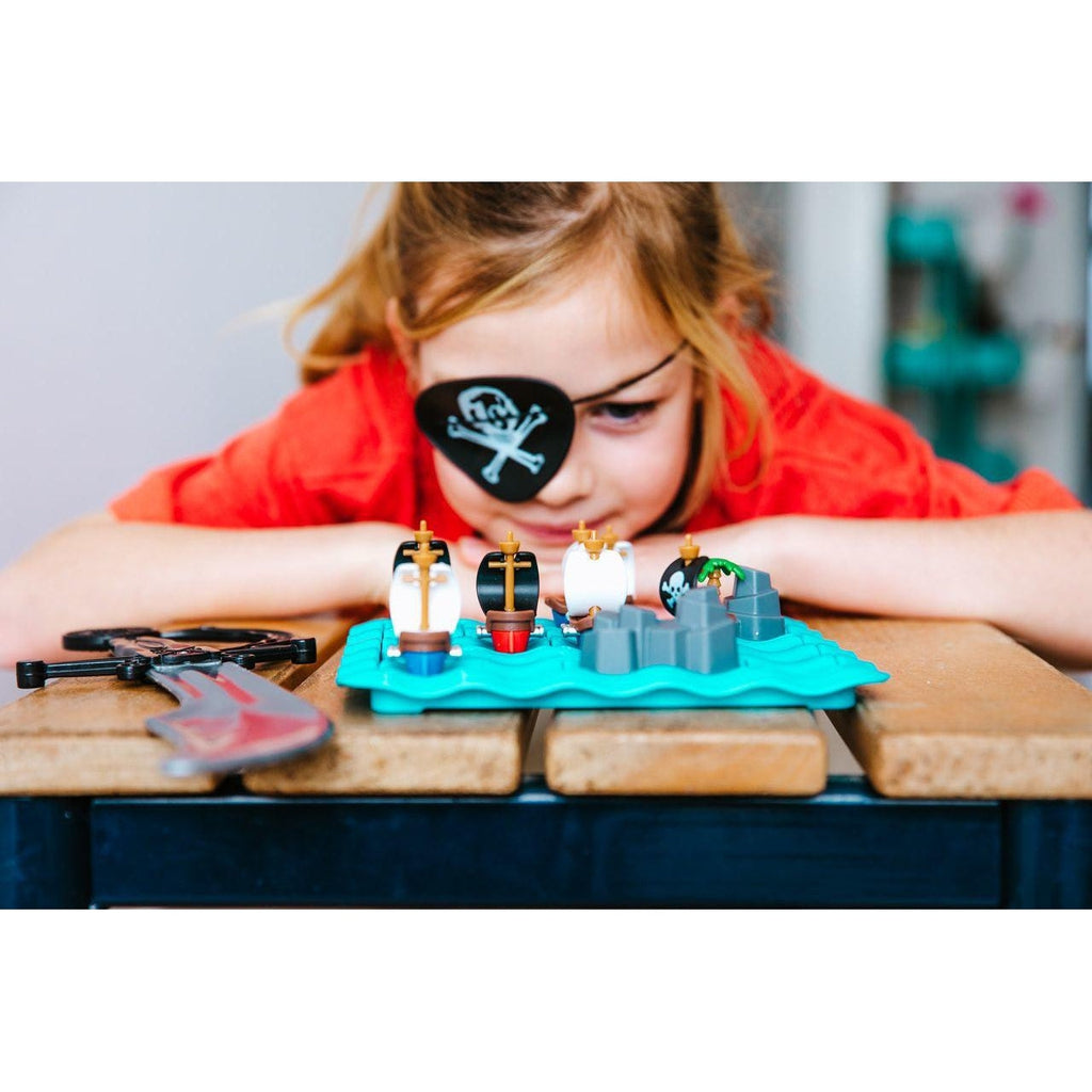 Scene of a little girl wearing an eye patch and playing with the puzzle game.