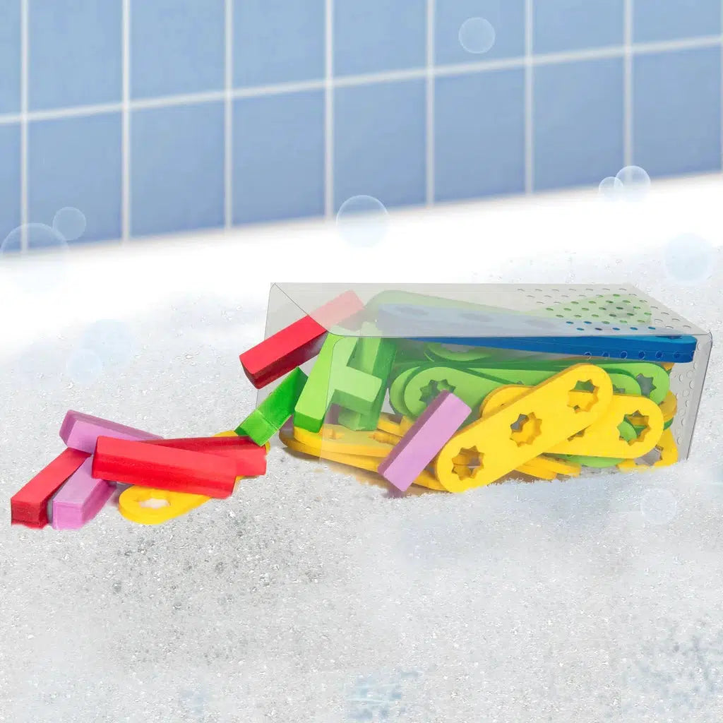 Shows that the set comes with a clear box to store the included pieces when it is not bath time. It has holes in the bottom so that water can drain out.