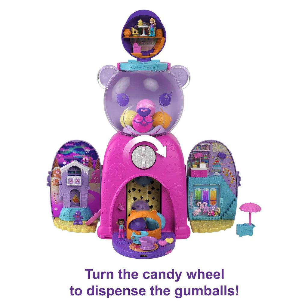 Shows that you can open up the gumball machine to reveal multiple different play areas. The include a gingerbread house,  a candy shop, and a place for Polly Pocket to eat.