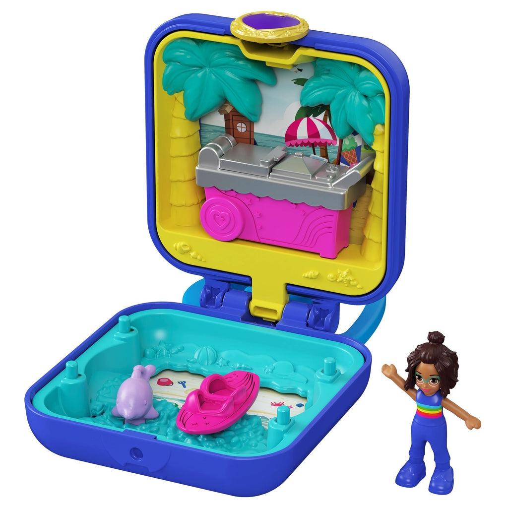Image of the summer themed Tiny Compact. It comes with a swimmer Polly Pocket, a pink floatie, and a dolphin. The inside has palm trees, a beach, and an ice cream stand.