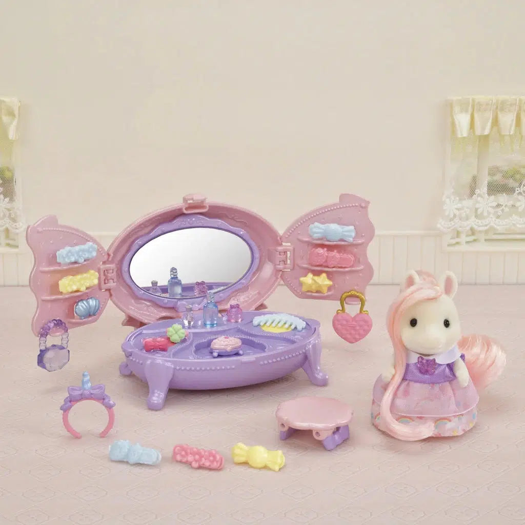 The image shows the display of the hair accessories kit, and the pony. Its a large toy dresser with a mirror in it so the pony can start the day looking pretty. 