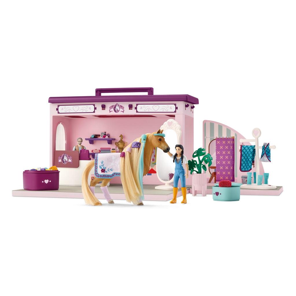 Image of the Pop-Up Boutique play set. It comes with two workers, a horse, and lots of horse grooming  tools and materials.