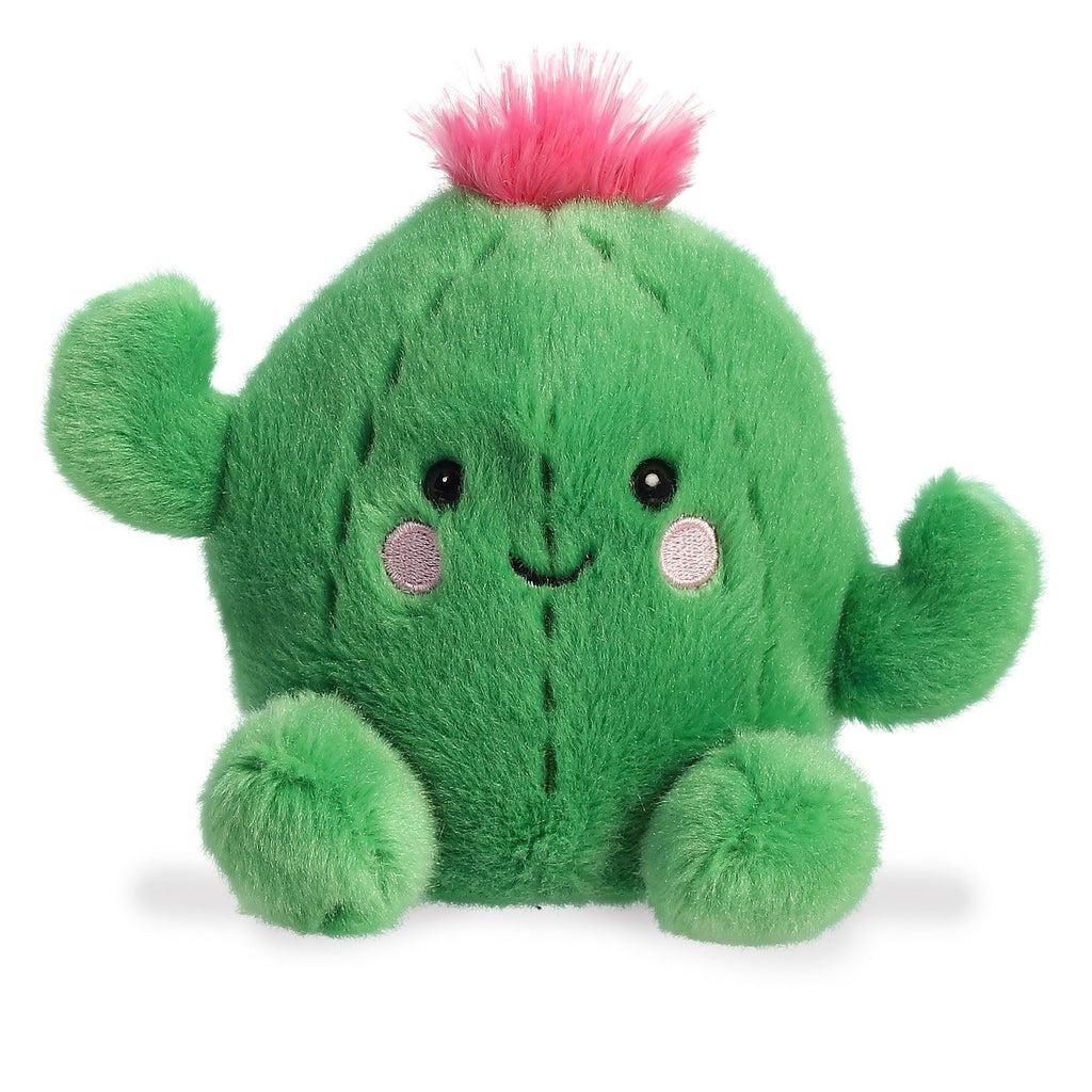 Image of the Prickles Cactus plush. He is all green with some line detail to make him more cactus like. He has two cactus arms pointing to the sky, a pink flower on top, and light pink blushies under his eyes.