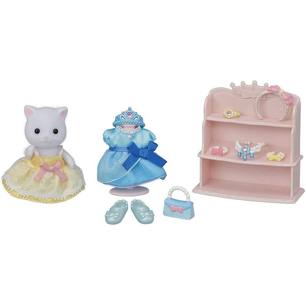 Image of the toys outside of the packaging. It comes with a white cat doll, two different colored dresses (yellow and blue) and many other princess accessories.