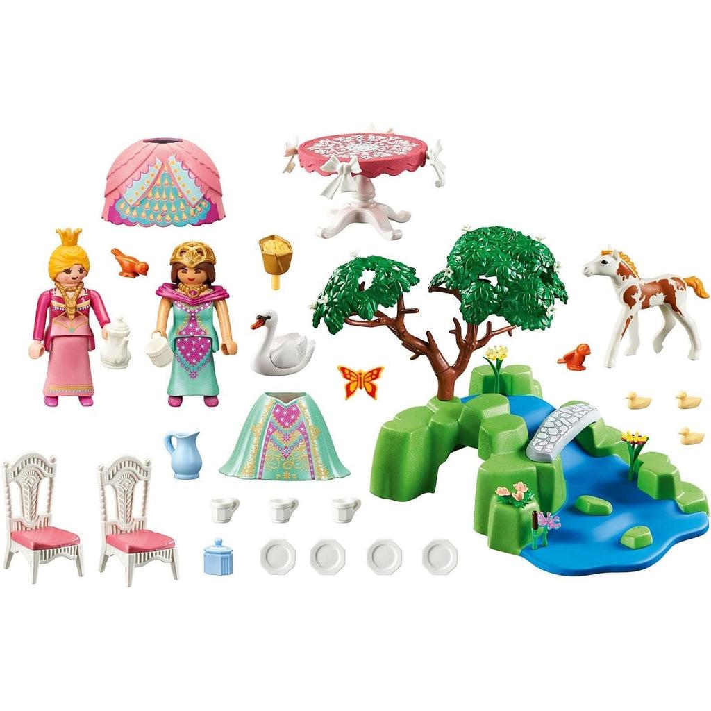Picture is a white background showing everything in the set, from the two princesses, the puffy dresses, the table and chairs for tea, along with cups and plates. a pitcher of water,three baby swans, a momma swan, a foal, some birds, and a butterfly
