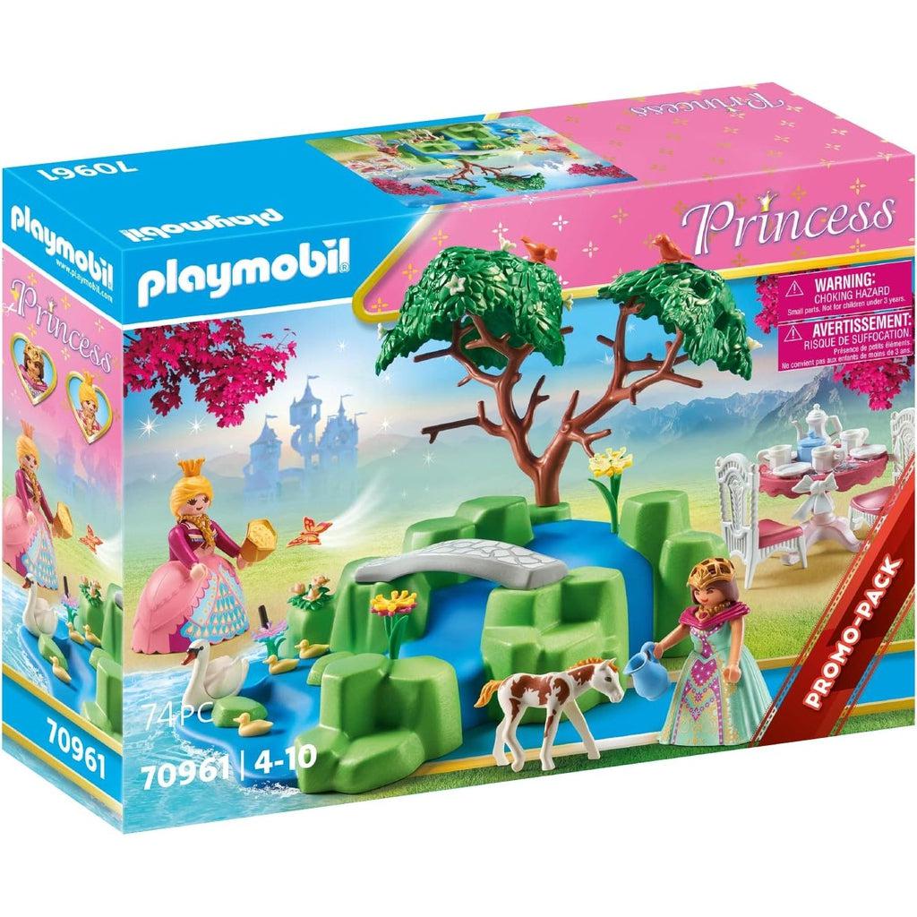 The picture shows the box for the princess and foal pack, with all the accessories sprawled out, two princessed, a foal, a swan, a tree and teaparty in the back
