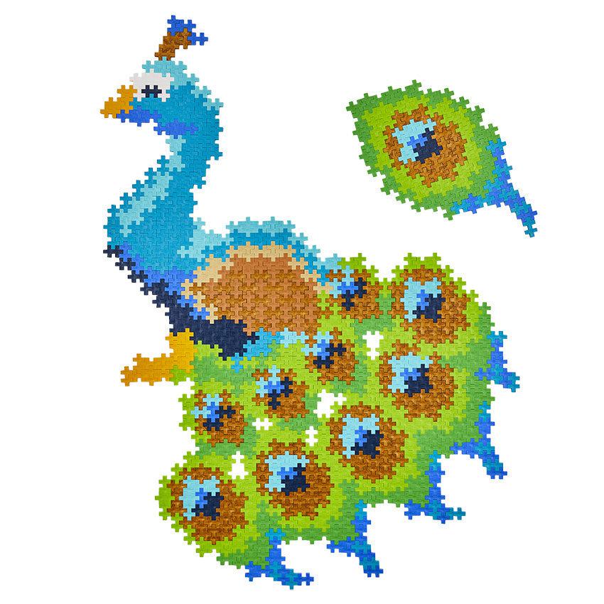 Image of the finished puzzle. It is made from hard plastic puzzle pieces shaped like two crosses attached together. They are made from many different colors to create a puzzle painting. The kit helps you made a peacock and a peacock feather puzzle.