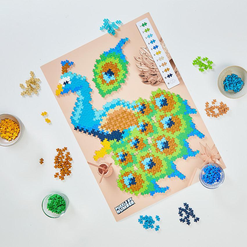 Image of the puzzle mid-built. Shows that the kit comes with 11 different colors of puzzle pieces to create the craft.