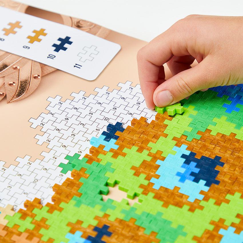 Image of a person following the instructions to complete the puzzle by number. It shows that it has a full-size pattern template so you can easily build the puzzle.