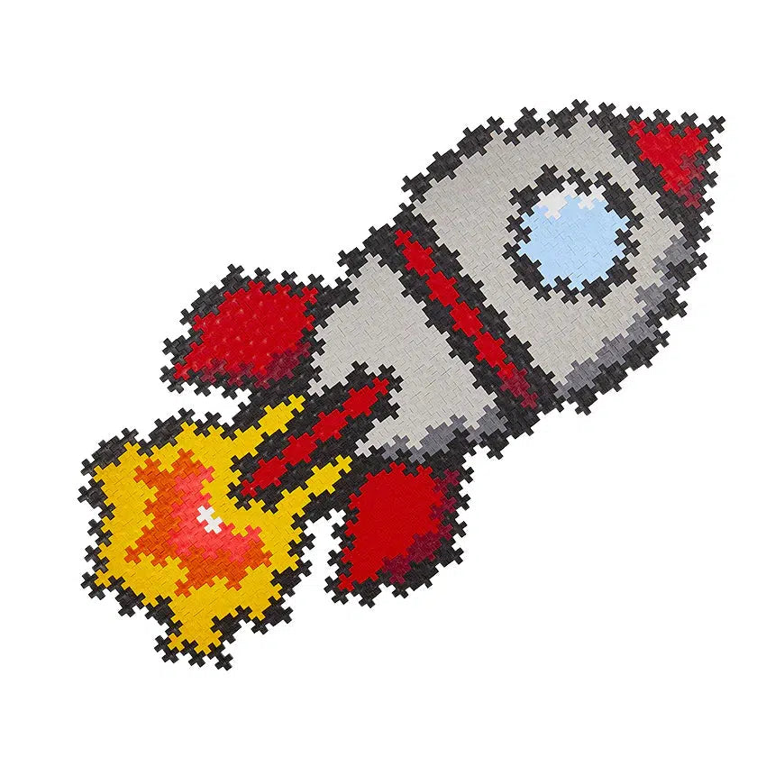 Image of the built puzzle. It is a rocket ship made from small double cross-shaped plastic puzzle pieces.