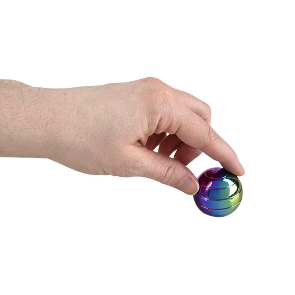 image shows the rainbow sphere being spn with someone holding on to the top