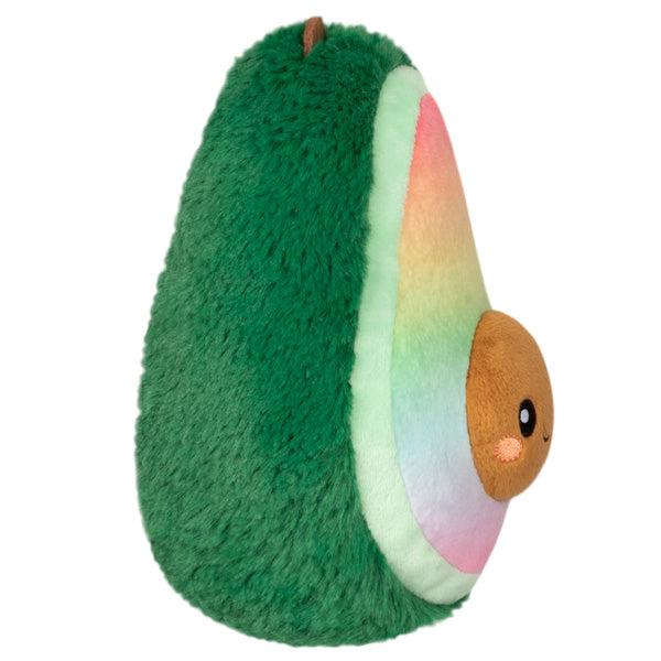 Side view of the plush. Shows that the pit of the avocado sticks out of the plush.
