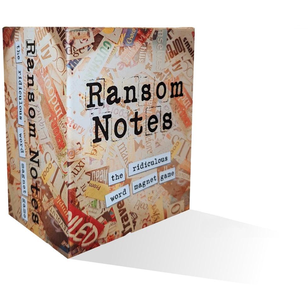 the box reads: Ransom Notes, the ridiculous word magnet game. The box background shows piles of words cut from magazines.