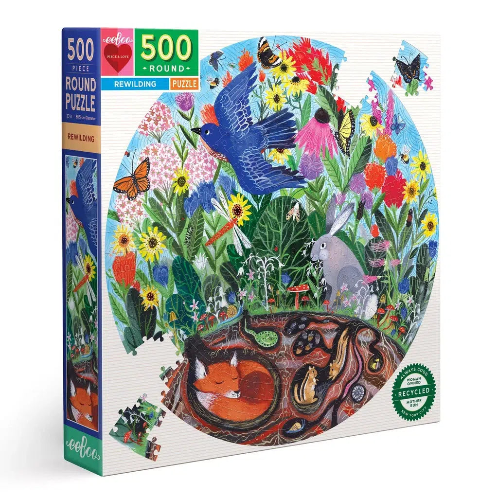 image shows the rewilding set for a 500 piece round puzzle. wild flowers are growing in a backyard with several animals like a fox, rabbit, squirrel, snake and bird