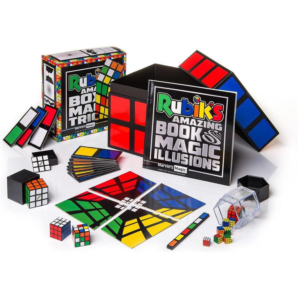 this image shows everything in the box, from instructinos, to several rubik;s cube themes items to make magic with.