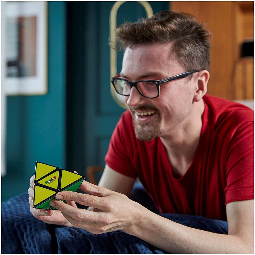 Scene of a man proud that he solved the Rubik's puzzle.