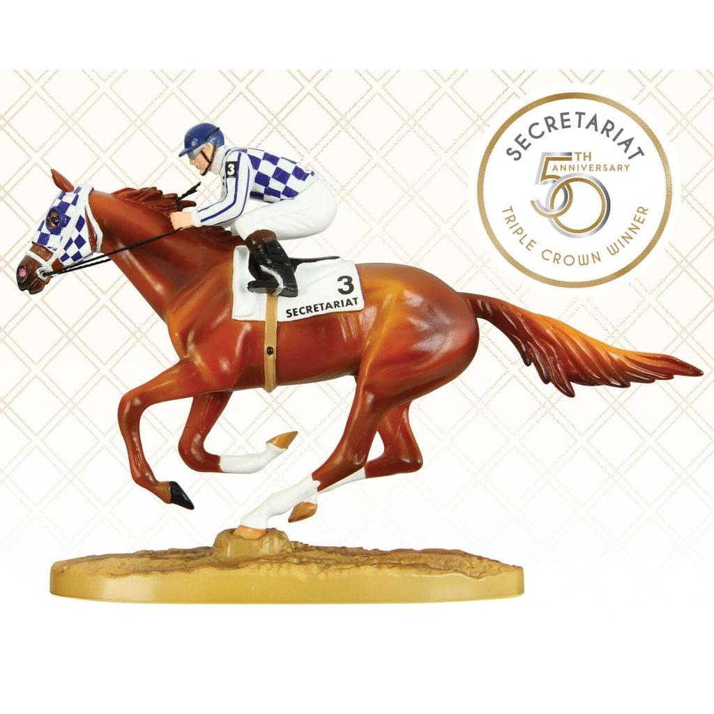 Image of the Secretariat with Jockey Figure. The horse is red-brown and set in a running postition. It is wearing a horse hat that has a blue and white checkered pattern that matches the jockey's uniform riding on him. Secretariat's number is 3.