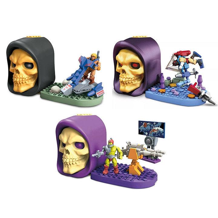 Image of all three possible Skelletor Skull sets you could recieve. One as a He-Man figurine inside, one has a Clamp Champ figurine inside, and one has a Moldak figurine inside
