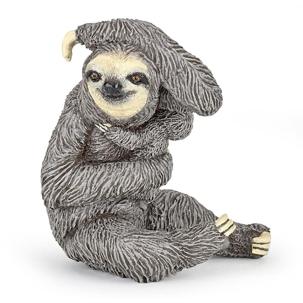 Image of the Sloth figurine. It is a grey furred sloth holding a smaller baby sloth in one arm. The other am is resting of top of its own head. It is in a sitting position.