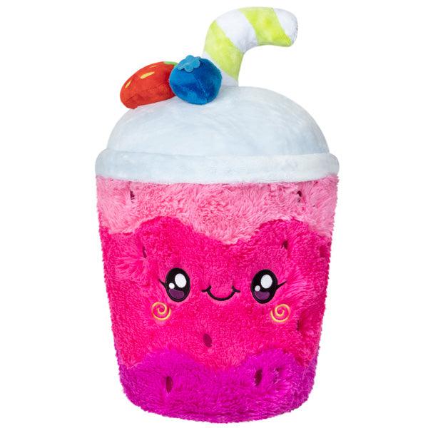 Image of the Smoothie squishable. It is a hot pink berry smoothie plush with berries and a straw on top.