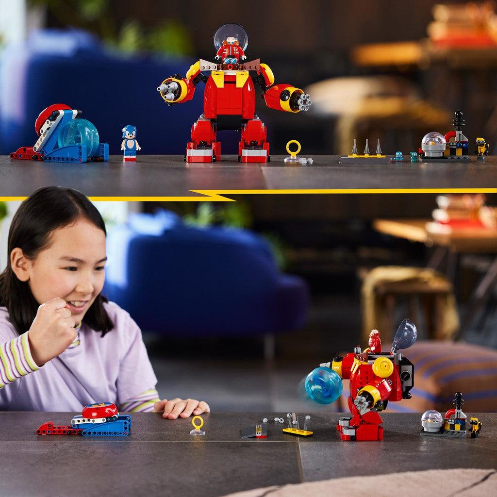 image shows a woman playing with the Sonic the Hedgehog LEGO set
