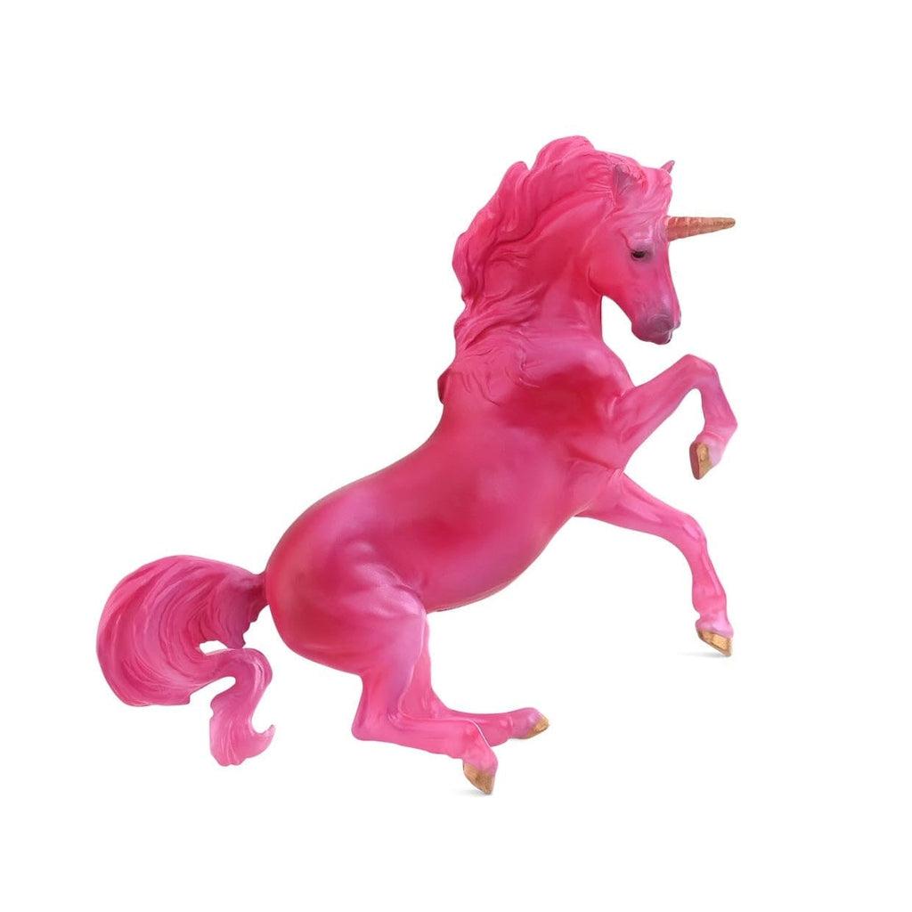 Image of the pink unicorn. She is completely hot pink with a golden horn and hooves.