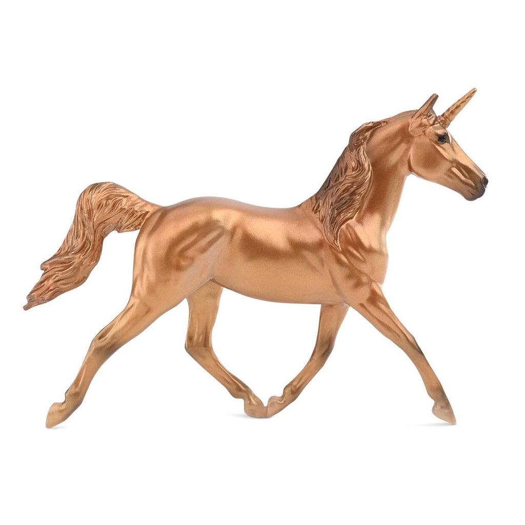 Image of the brass colored unicorn. It is completely brass colored and very shiny.