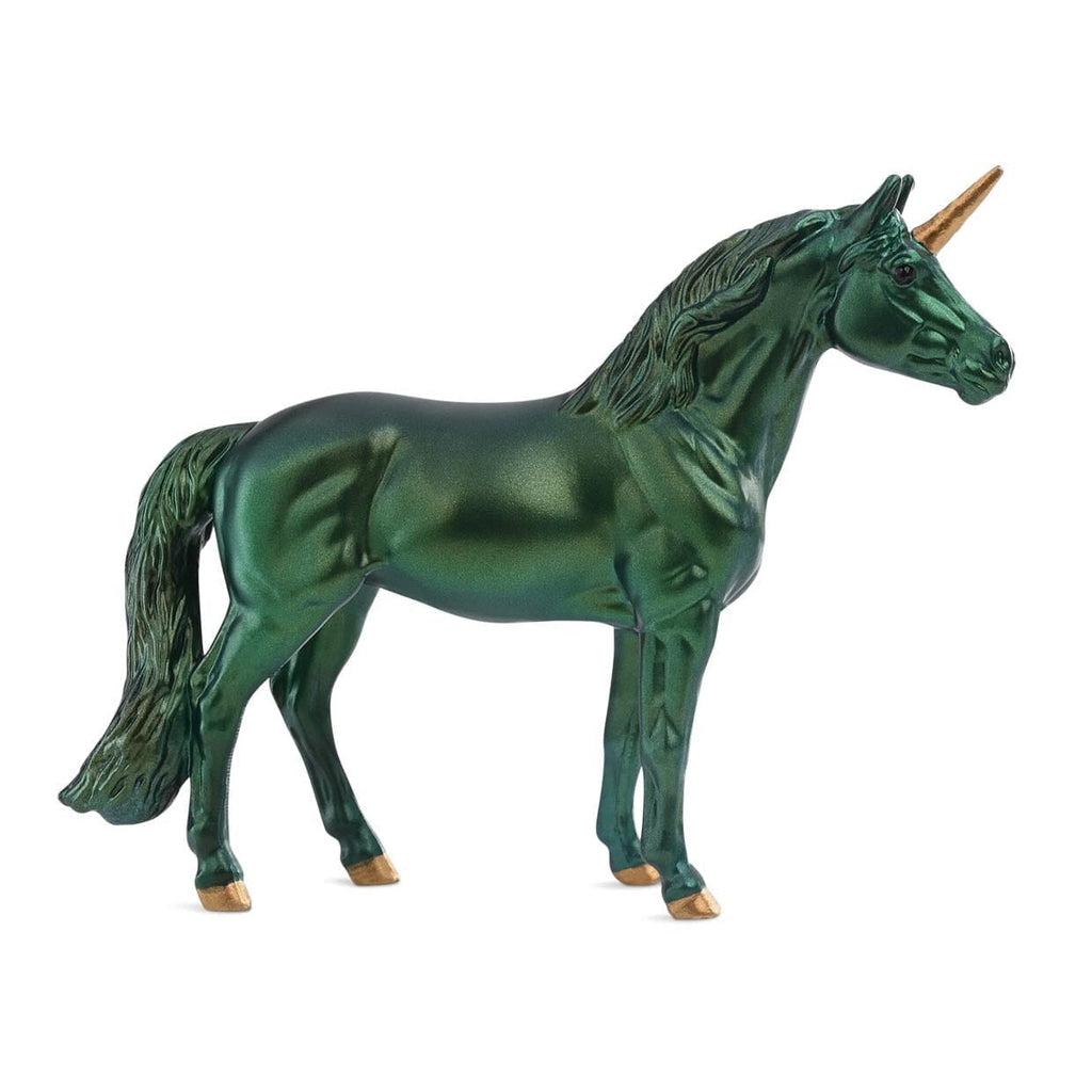 Image of the emerald unicorn. It is a very shiny and completely emerald colored horse with golden hooves and horn.