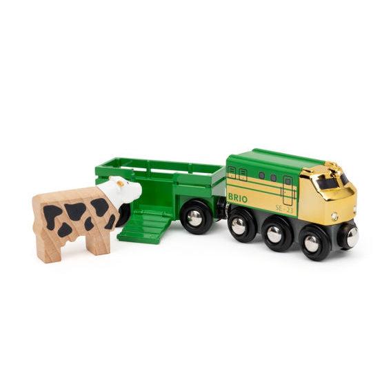 Image of the toy outside of the packaging. It comes with a green and yellow locomotive, a green livestock car, and a wooden cow.