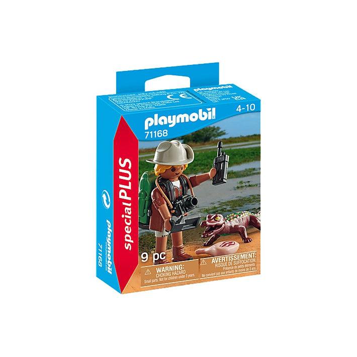 A young researcher is exploring the wilds with a camian on the box. The playmobil figure almost looks like steve erwin