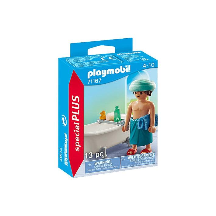 The special plus playmobil figure shows a man with a towel around his waist ready for a bath. he has a rubber ducky and soap.