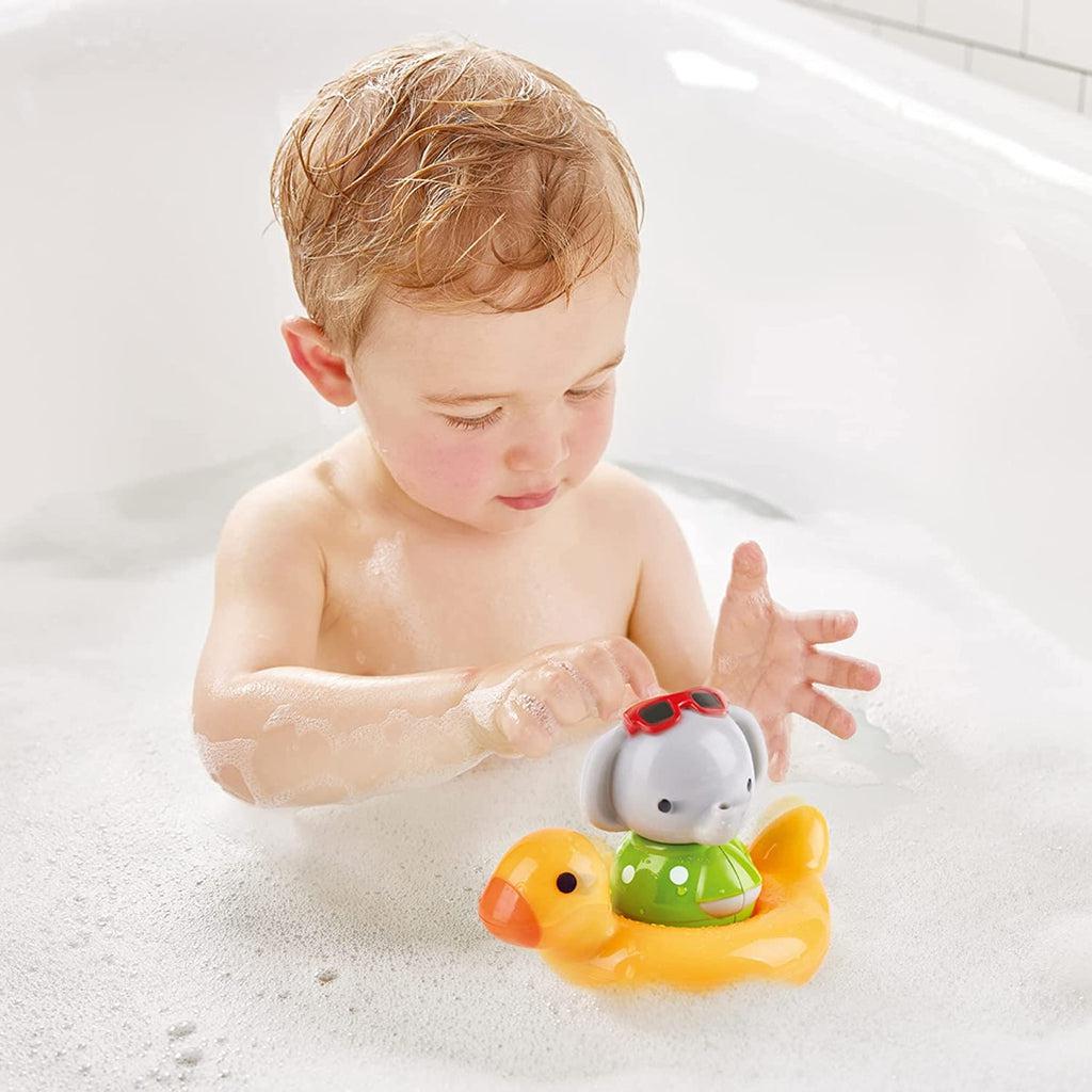 Scene of a little boy playing with the bath toy.