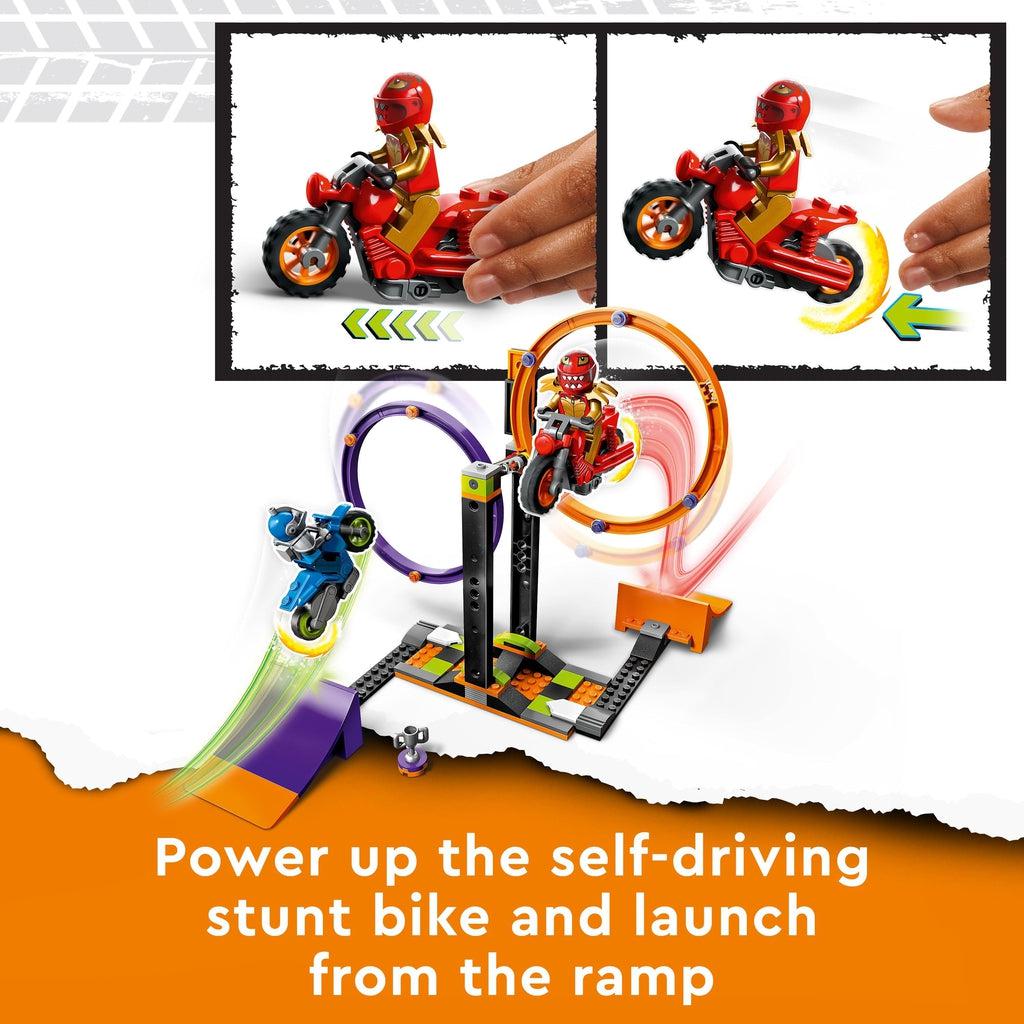 Close up on the two included LEGO minibikes. They can drive themselves by pulling back and releasing. Caption: Power up the self-driving stunt bike and launch from the ramp