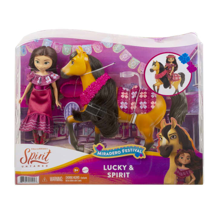 Image of the packaging for Spirit & Lucky Riding Free Festival. The front is made from clear plastic so you can see the dolls inside.