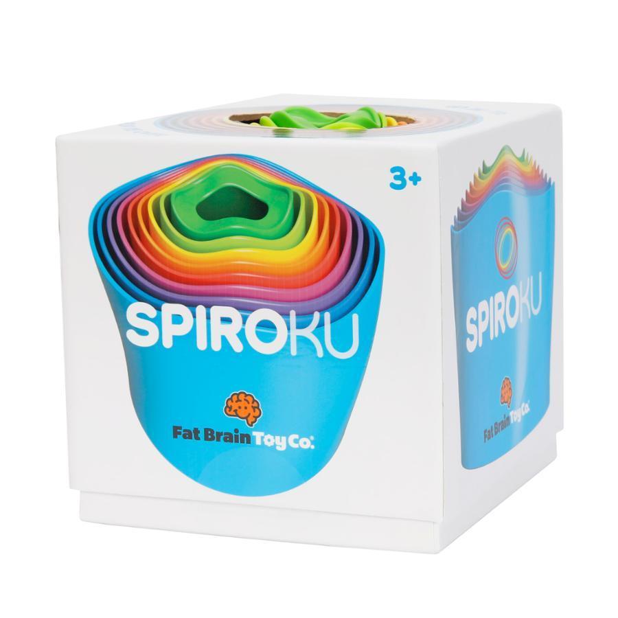 Image of the packaging for the SpiroKu toy. On the front is a picture of the collapsed toy. Part of the top is cut away with the top of the toy sticking out so you can see it and touch it.