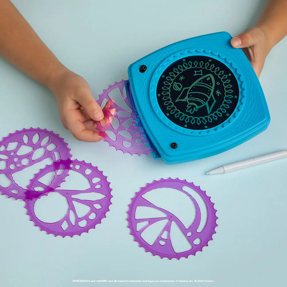 this image shows there are 4 discs that can fit in the spirograph with unique shapes to draw with